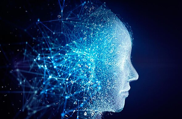 A digital representation of a human head in profile, composed of glowing blue lines and nodes, symbolizing technology and neural networks against a dark background. The image conveys themes of artificial intelligence and data connectivity.