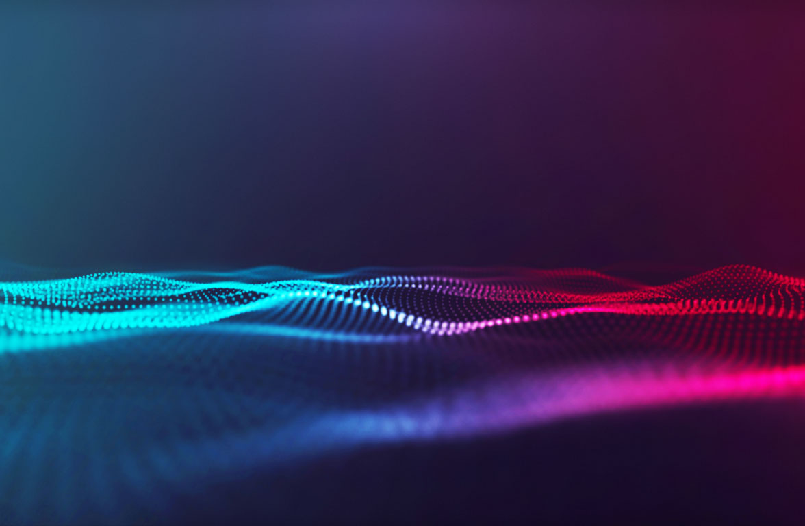 Eine abstrakte Darstellung von Wellen, die in verschiedenen Blautönen und Rosatönen leuchten. Der Hintergrund ist dunkel, wodurch die Wellenstruktur hervortritt und eine dynamische, fließende Bewegung suggeriert.