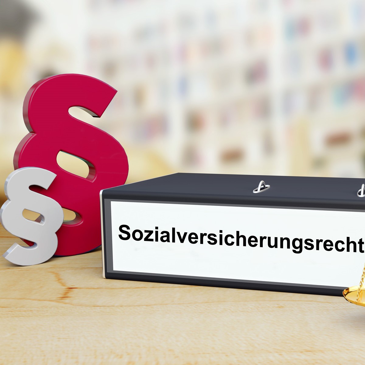 A black folder labeled "Sozialversicherungsrecht" sits on a wooden surface, accompanied by decorative, large ampersand symbols in red and gray. The background is blurred, focusing attention on the folder and symbols related to social security law.