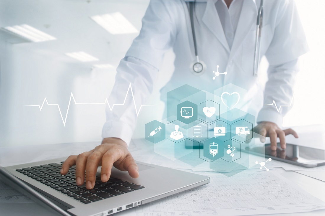 A healthcare professional in a white coat is using a laptop, with a focus on a hand on the keyboard. Overlaid are digital icons representing medical services, such as a heart, syringe, and medical documents, suggesting the integration of technology in healthcare.