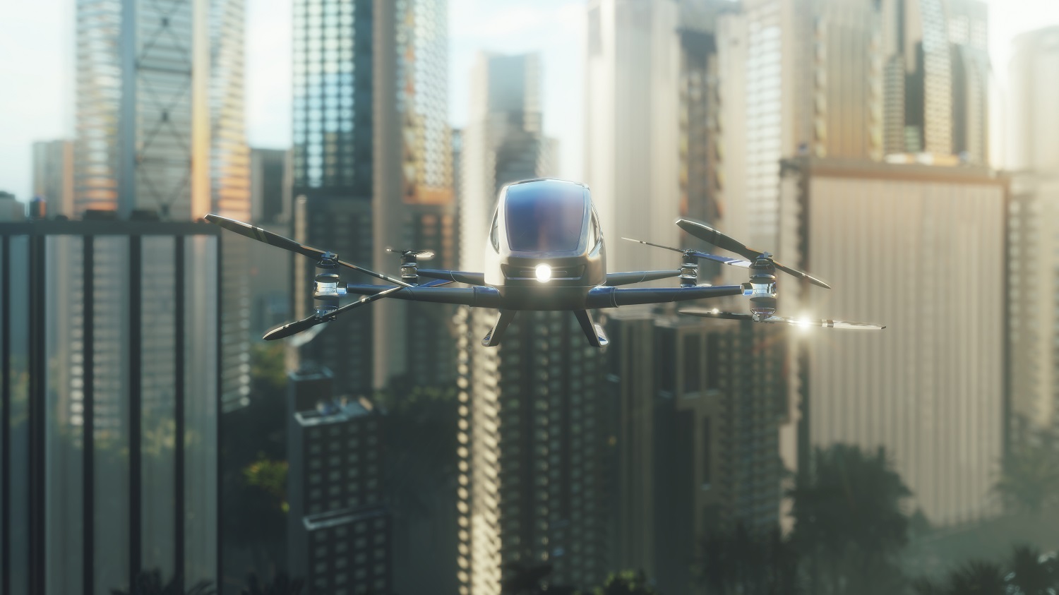 A futuristic drone with multiple rotors is flying amidst tall skyscrapers in an urban setting. The drone is designed for urban transport, featuring a sleek body and bright lights, capturing the essence of advanced technology in city travel.