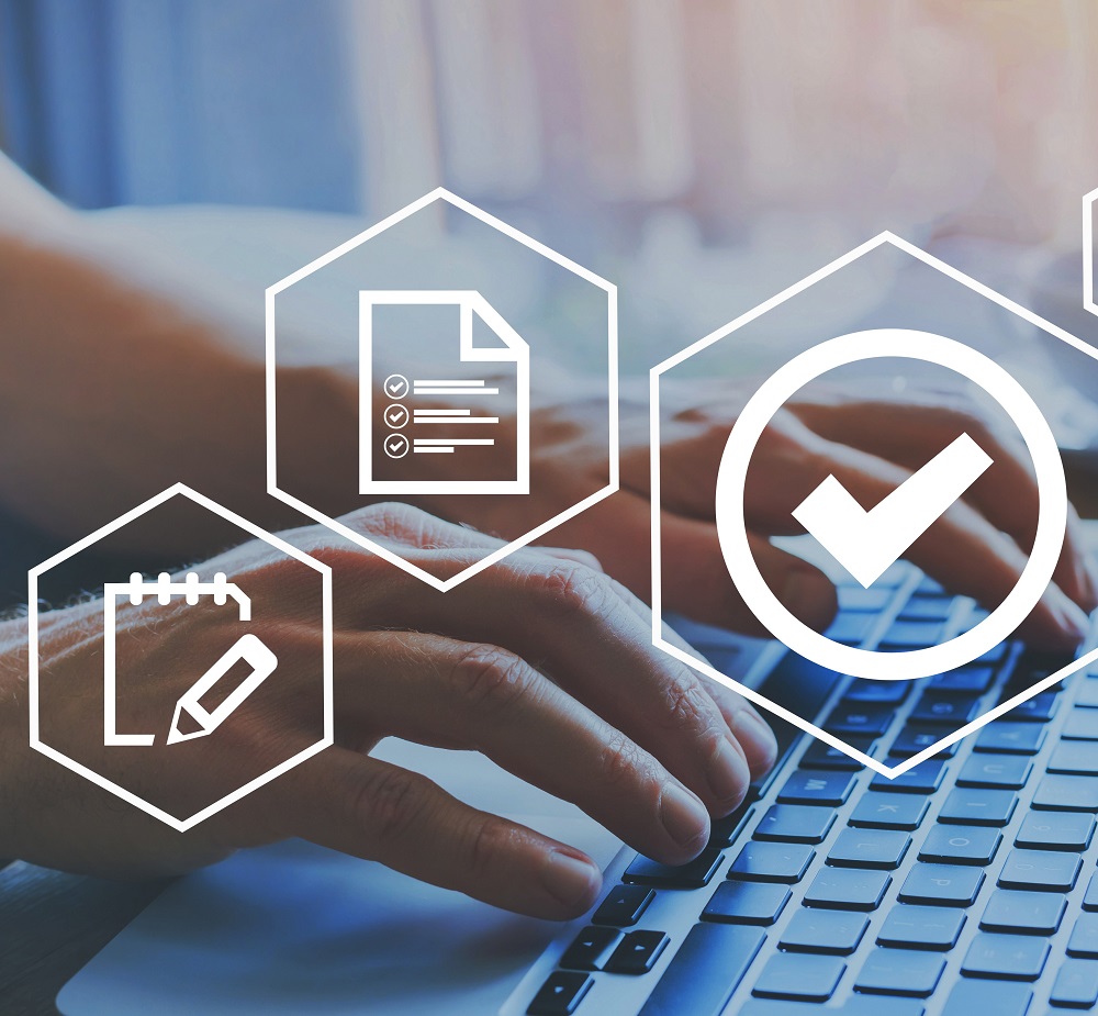 A person's hands typing on a laptop keyboard, surrounded by icons representing a checklist, a notepad, and a checkmark. The image conveys themes of productivity, organization, and task completion.