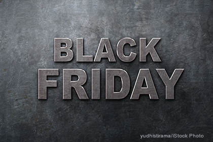 The image features the bold text "BLACK FRIDAY" in a metallic style against a textured gray background, emphasizing the significance of this shopping event.