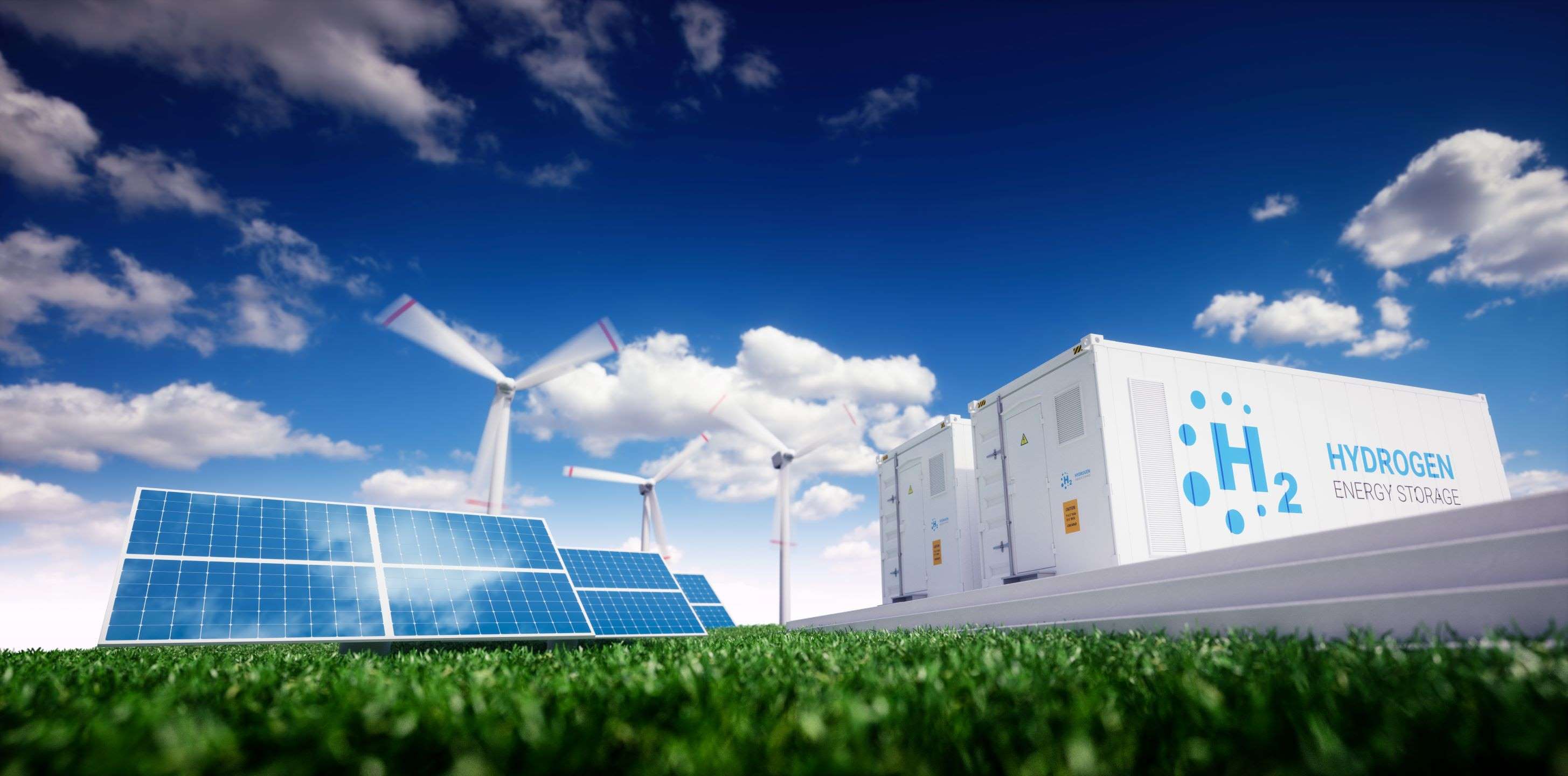 The image features solar panels and wind turbines against a blue sky with clouds. There are storage units labeled "H₂ HYDROGEN ENERGY STORAGE," emphasizing a focus on renewable energy solutions and sustainable practices. The setting is grassy, highlighting an eco-friendly environment.